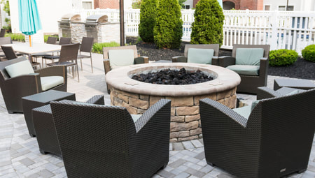 fire pit surrounded by chairs 