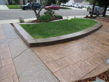 Stamped concrete driveway gives a fresh look out front of a home